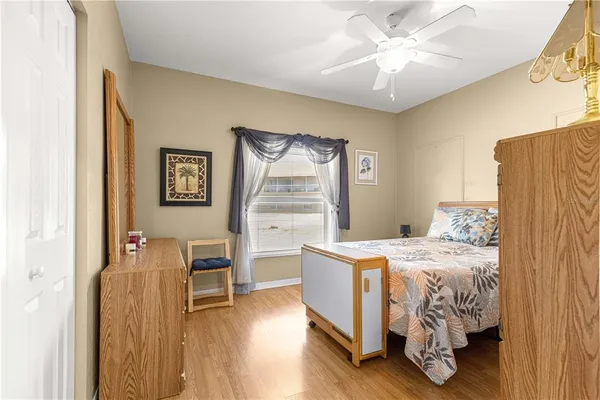 a bed room with a bed and a chandelier