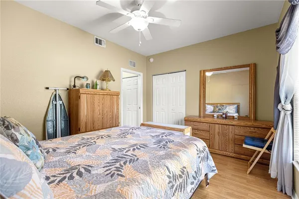 a bedroom with a bed and a dresser