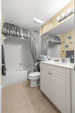 a bathroom with a sink a toilet and bathtub