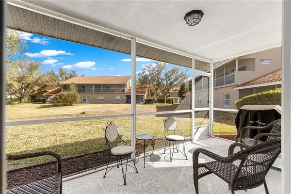 a living room with table and chairs