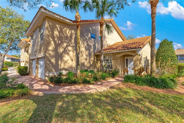 a view of a house with a yard