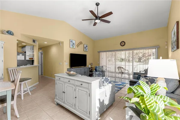 a view of living room with furniture and flat screen tv