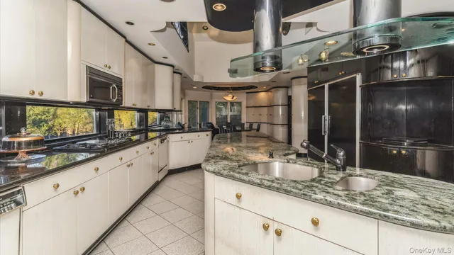 a bathroom with sinks and a large mirror