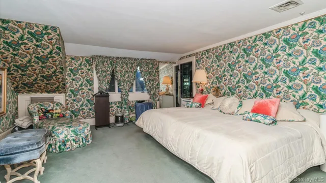 a room with granite countertop a sink and a shower