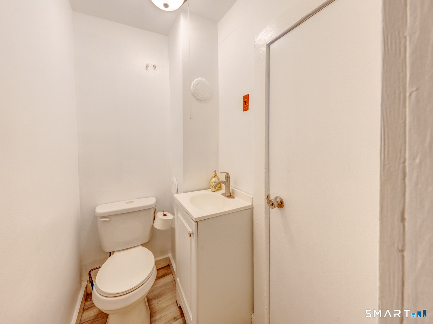 7 Rose Street Norwich, CT 06360 - Photo 20 of 37 a white toilet sitting next to a white sink