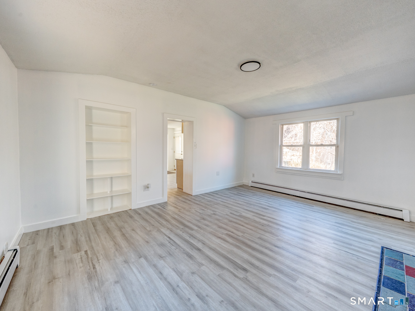 7 Rose Street Norwich, CT 06360 - Photo 23 of 37 an empty room with wooden floor and windows