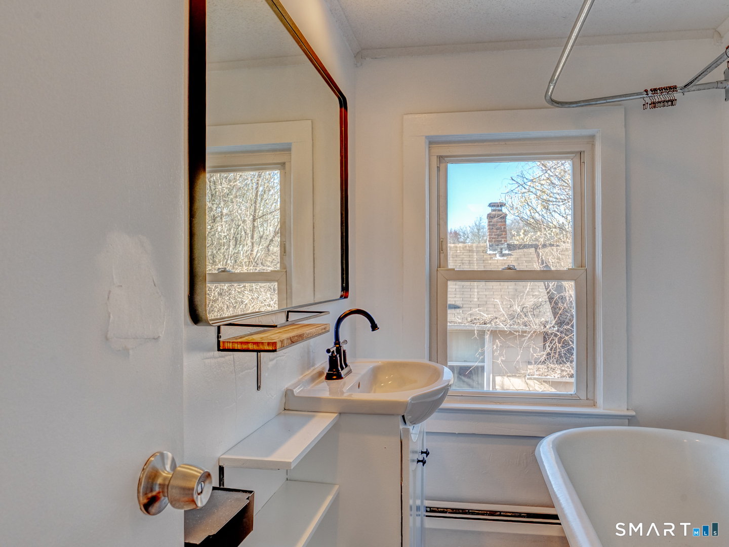 7 Rose Street Norwich, CT 06360 - Photo 28 of 37 a bathroom with a sink and a window
