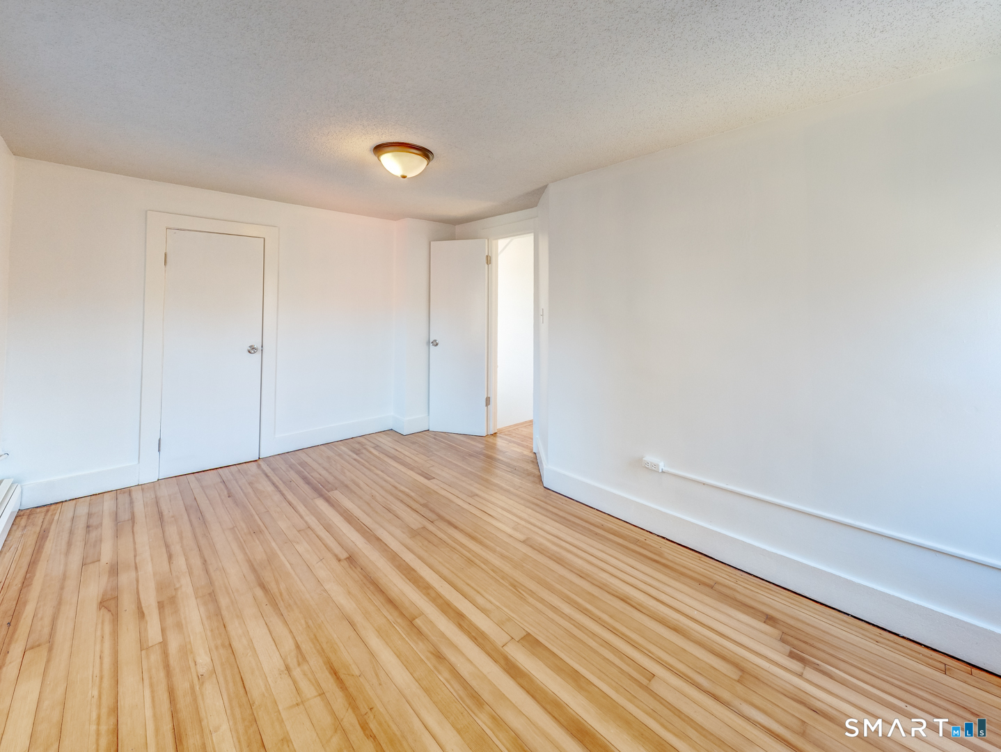 7 Rose Street Norwich, CT 06360 - Photo 31 of 37 a view of empty room with wooden floor