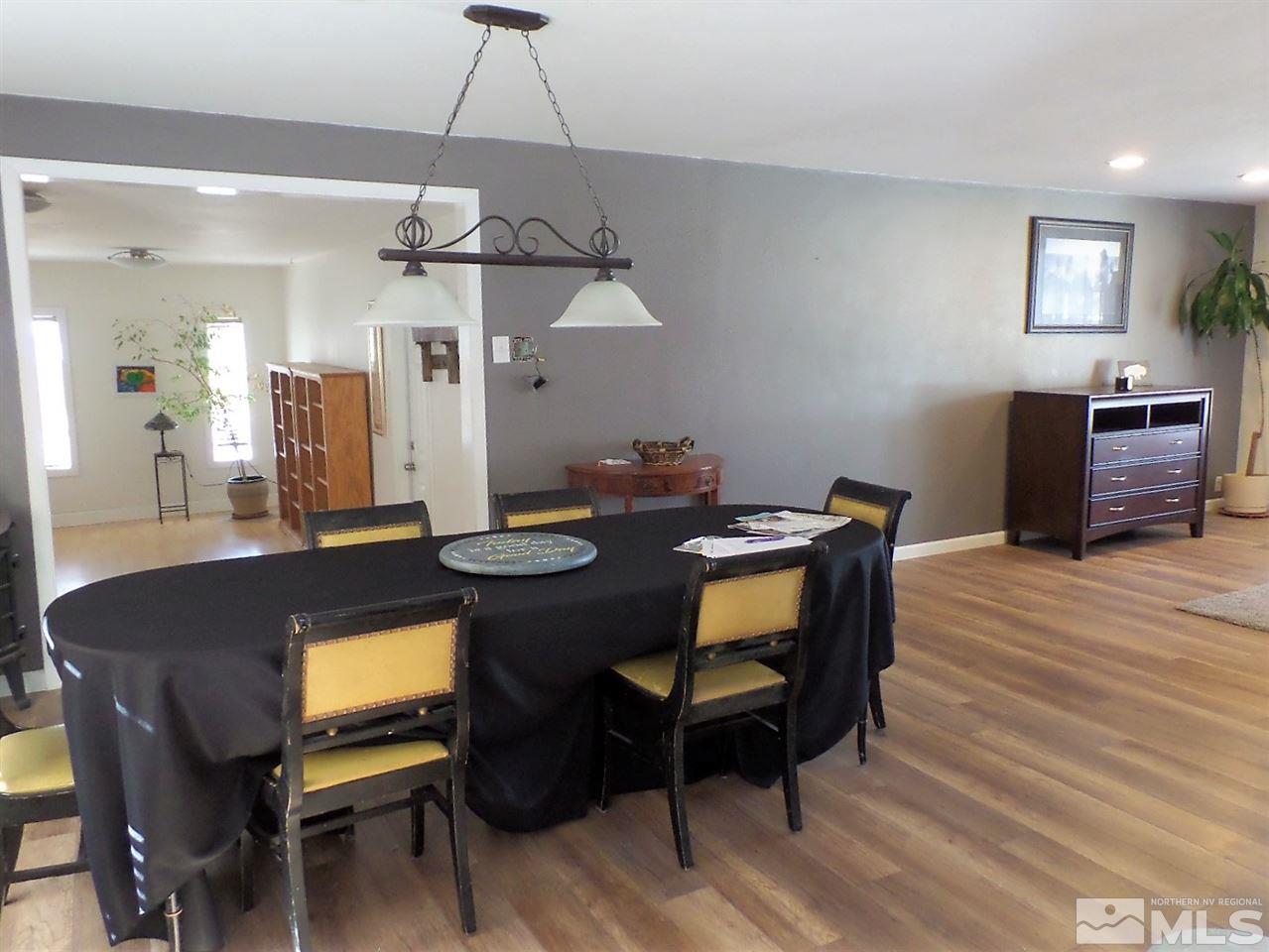 2590 Trentham Way Reno, NV 89509 - Photo 11 of 25 a view of a dining room with furniture and wooden floor