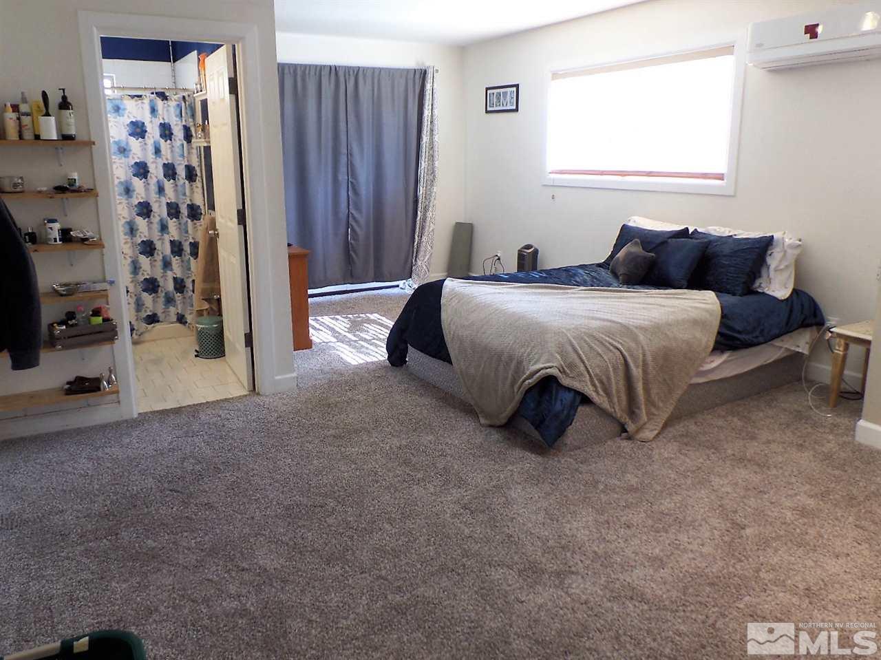 2590 Trentham Way Reno, NV 89509 - Photo 19 of 25 a spacious bedroom with a bed and a window