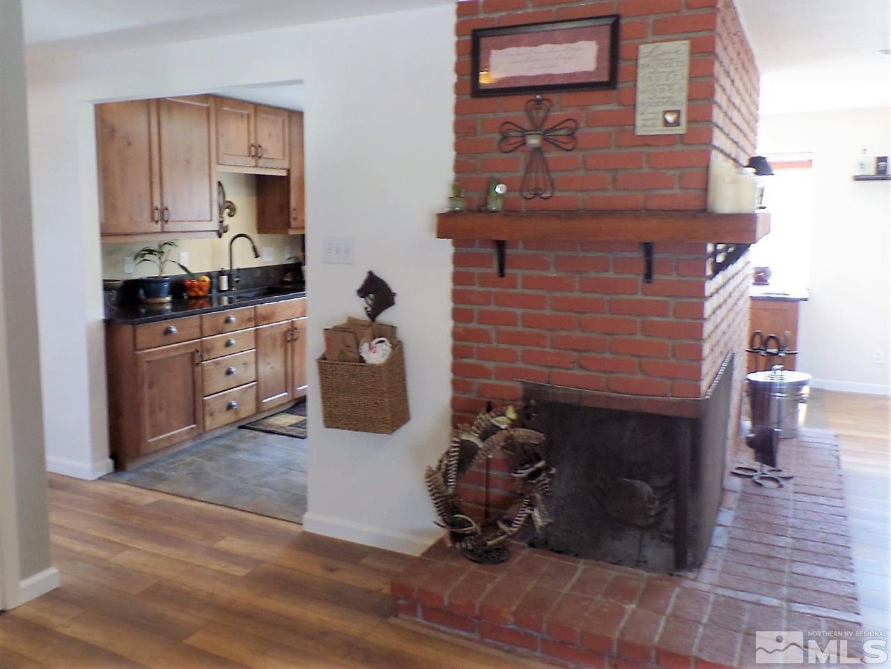 2590 Trentham Way Reno, NV 89509 - Photo 3 of 25 a kitchen with a stove and a wooden floor