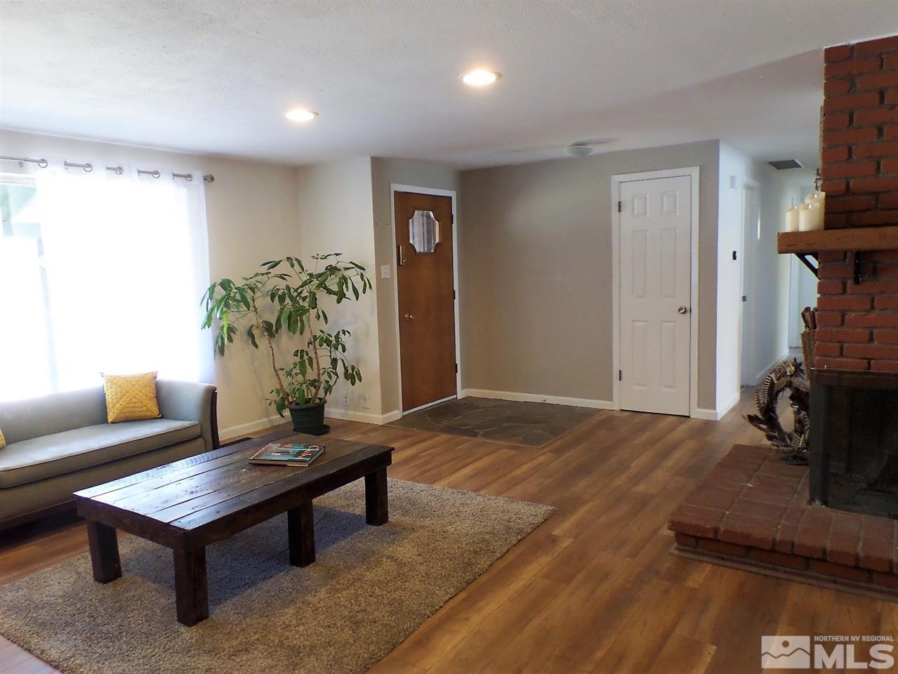 2590 Trentham Way Reno, NV 89509 - Photo 4 of 25 a living room with furniture and a wooden floor