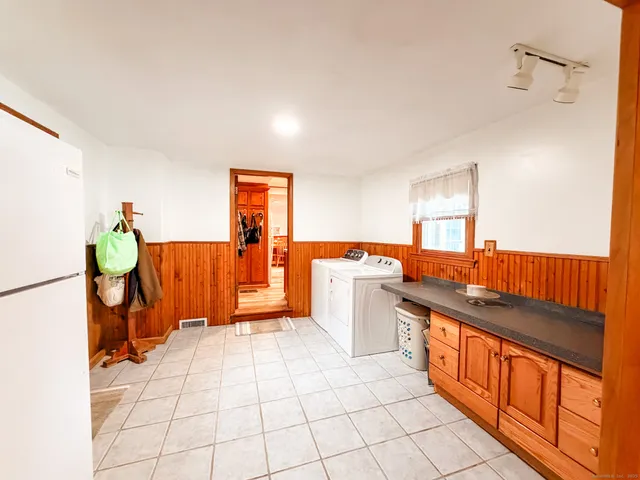 a kitchen with stainless steel appliances granite countertop a sink and a cabinets