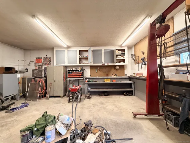 a living room with furniture a flat screen tv and a window