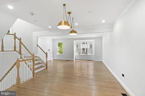 a view of an entryway with wooden floor