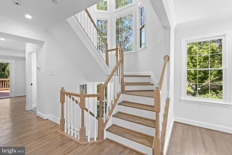 a view of entryway with wooden floor and stair