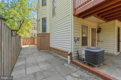 a view of house with outdoor space and seating area