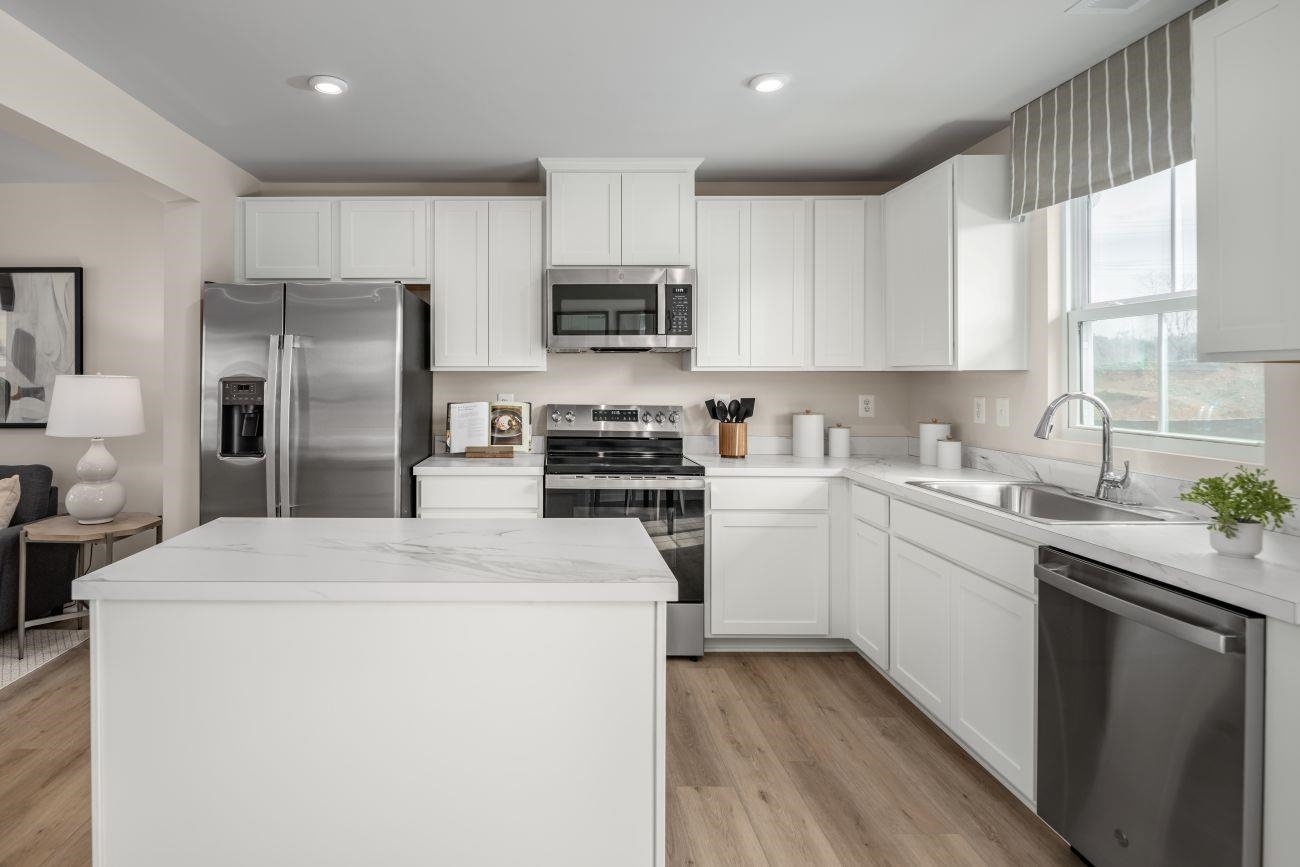 2886 Orchard Ridge Lane Harrisonburg, VA 22801 - Photo 2 of 14 a kitchen with refrigerator a sink and cabinets