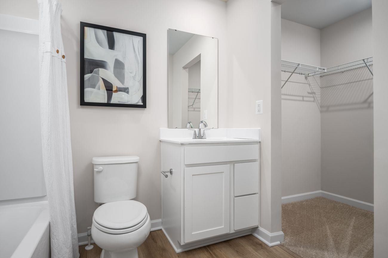2886 Orchard Ridge Lane Harrisonburg, VA 22801 - Photo 8 of 14 a bathroom with a toilet sink and mirror