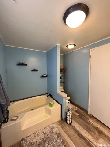 a bathroom with a tub and a sink