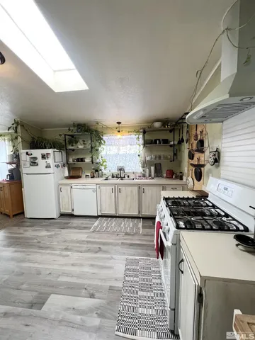 a kitchen with a stove and a refrigerator