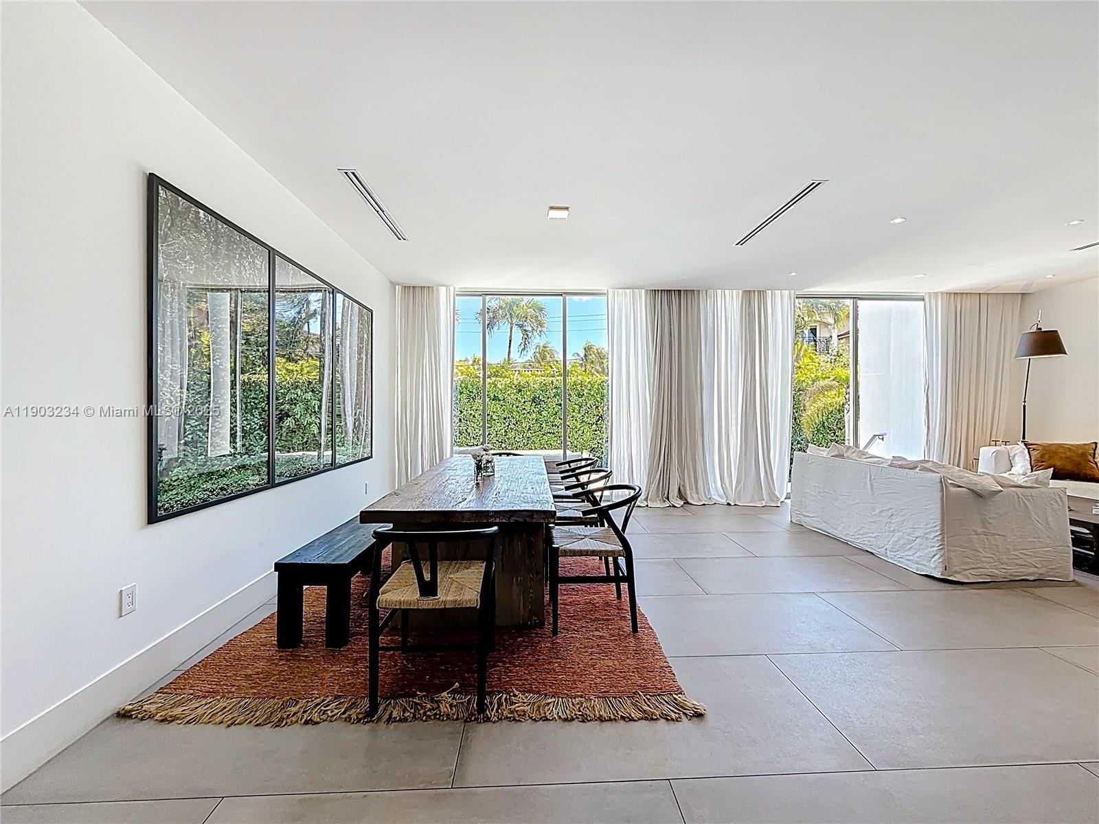 Key Biscayne Key Biscayne, FL 33149 - Photo 12 of 46 a living room with furniture and a large window