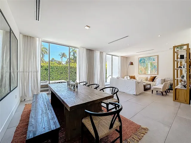 a view of a livingroom with furniture and a window