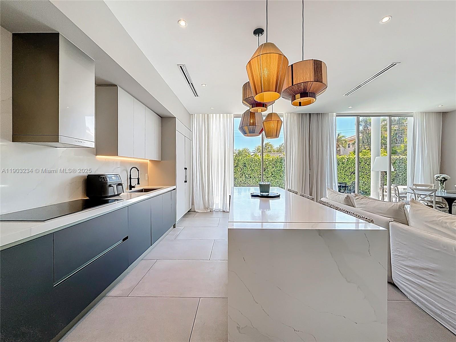 Key Biscayne Key Biscayne, FL 33149 - Photo 15 of 46 a large kitchen with stainless steel appliances a large counter top a stove and a sink