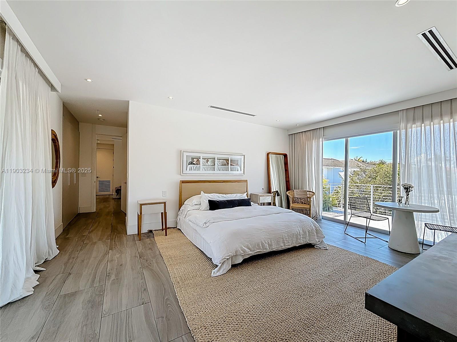 Key Biscayne Key Biscayne, FL 33149 - Photo 23 of 46 a bedroom with a bed and large window