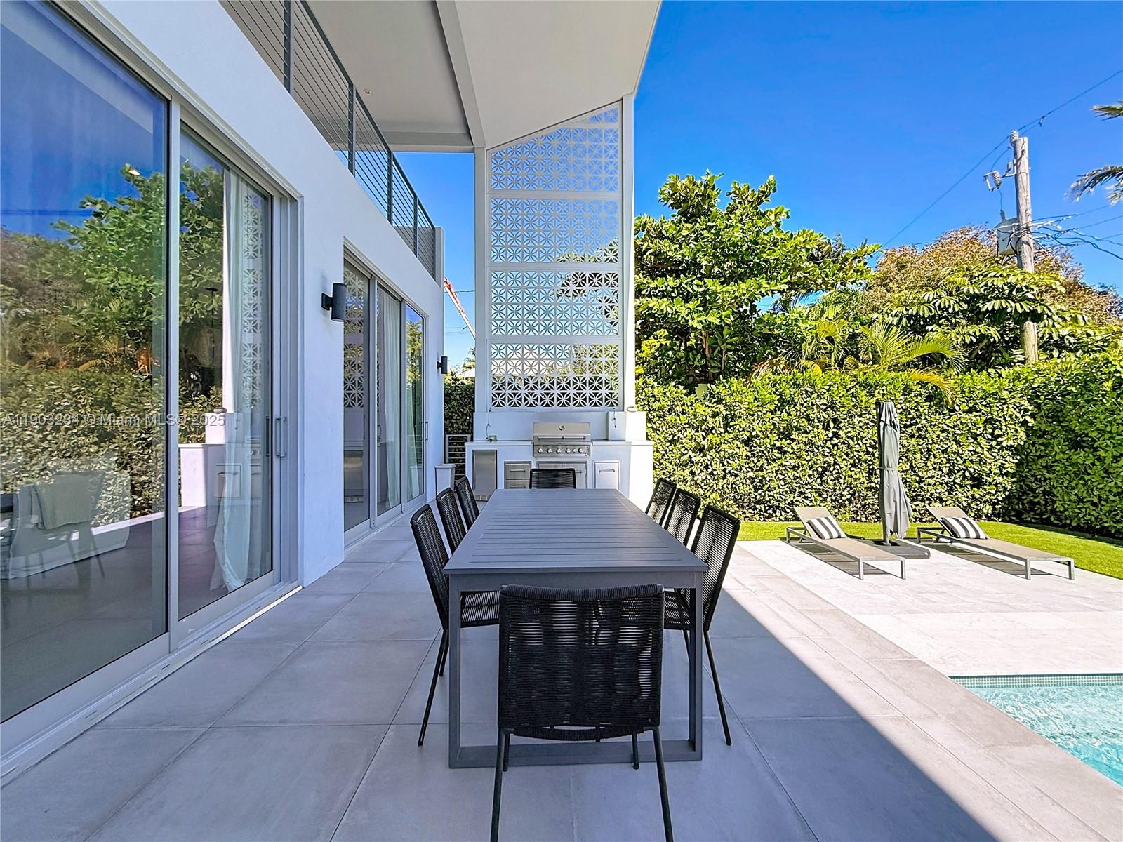 Key Biscayne Key Biscayne, FL 33149 - Photo 41 of 46 a view of a dining table and chairs in the patio