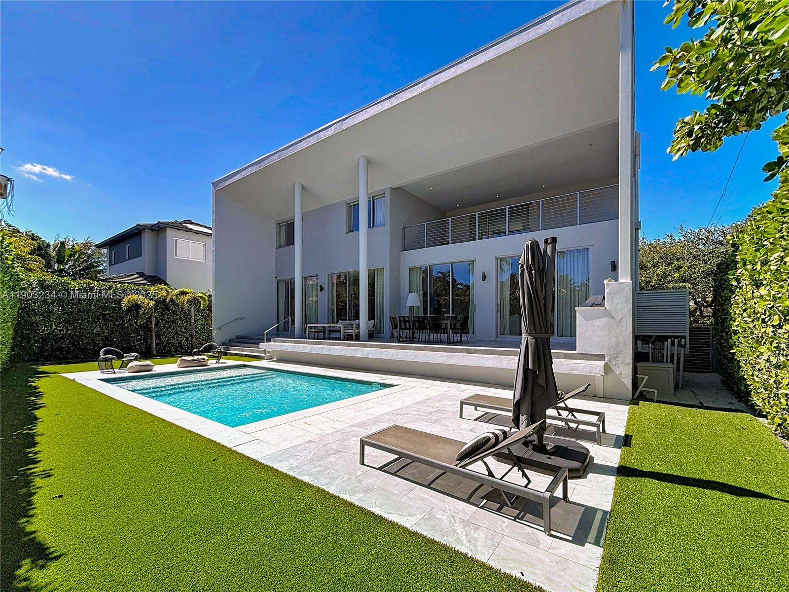 Key Biscayne Key Biscayne, FL 33149 - Photo 45 of 46 a front view of a house with swimming pool