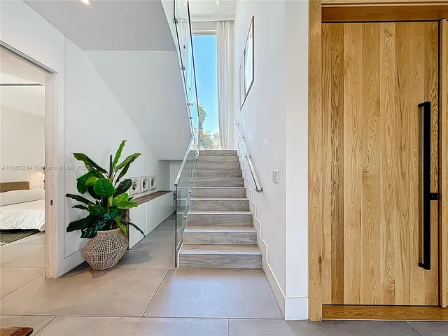 a view of entryway with wooden door
