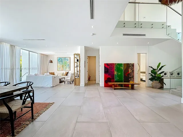a view of a livingroom with furniture and a flat screen tv