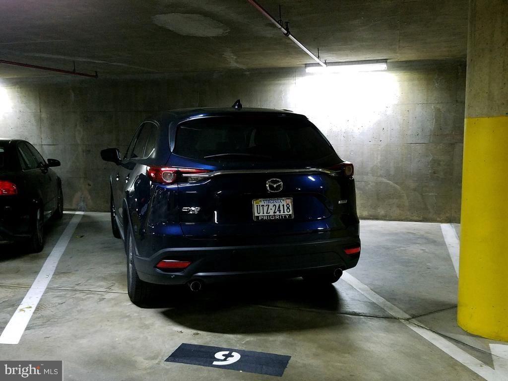 1001 North Randolph Street, Unit 406 Arlington, VA 22201 - Photo 18 of 23 a car parked in a garage