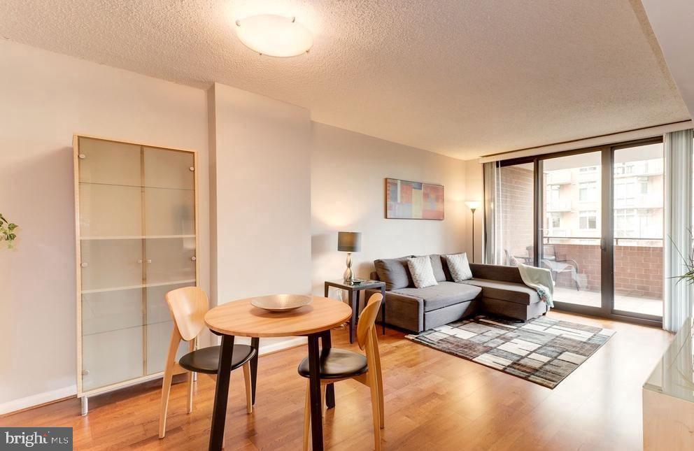 1001 North Randolph Street, Unit 406 Arlington, VA 22201 - Photo 23 of 23 a living room with furniture and a window