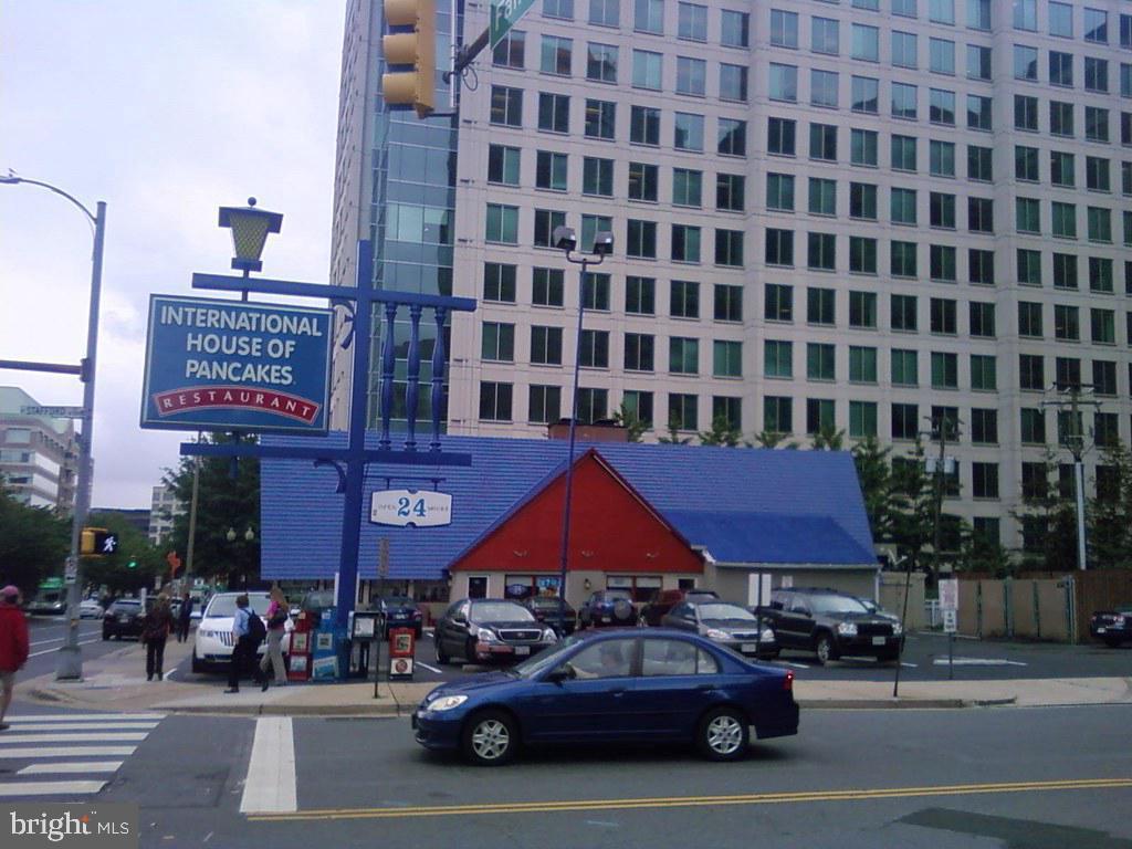1001 North Randolph Street, Unit 406 Arlington, VA 22201 - Photo 22 of 23 a car parked in front of a building