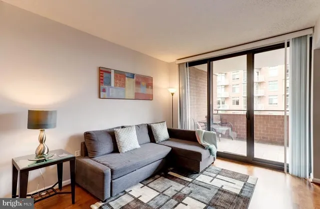 a living room with furniture and a window