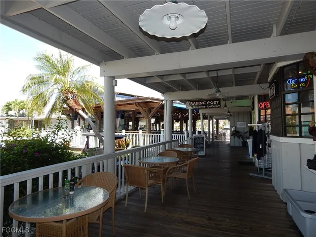 a view of a chairs and table in a patio
