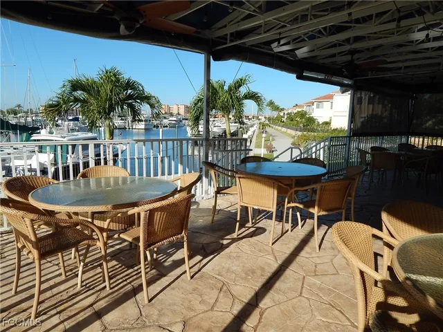a view of a chairs and table in patio