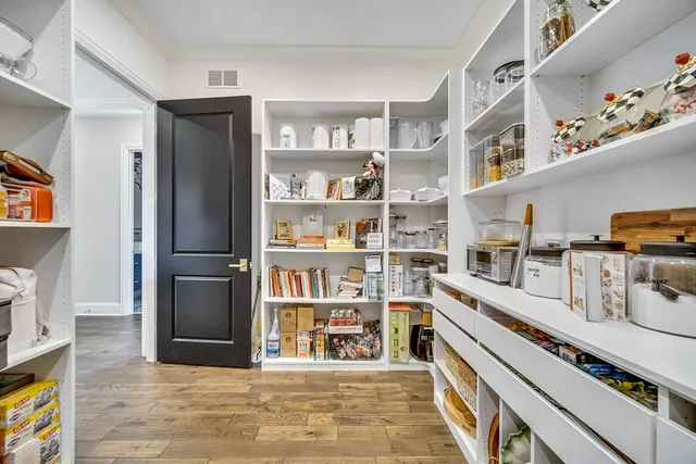 a bathroom with a granite countertop sink a toilet and a mirror
