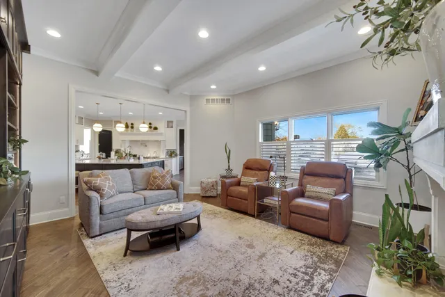 a bedroom with a bed window and couch