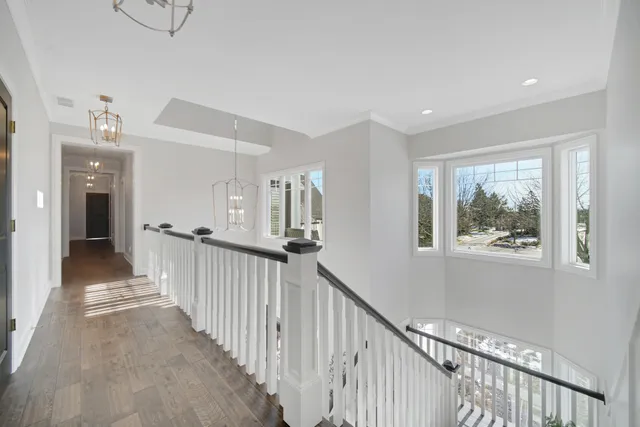 a kitchen with white cabinets and refrigerator