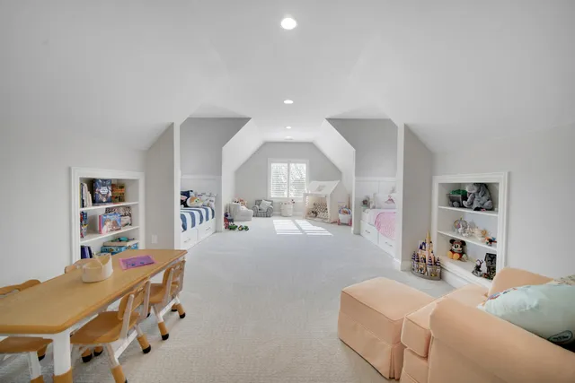 an aerial view of residential houses with outdoor space and swimming pool