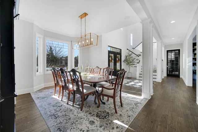 a living room with fireplace furniture and a wooden floor