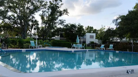 a kitchen with stainless steel appliances granite countertop a sink a stove and a microwave