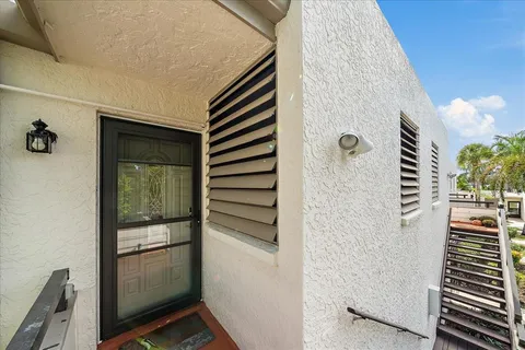 a large kitchen with stainless steel appliances granite countertop a stove refrigerator and microwave