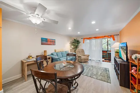 a bedroom with furniture and a floor to ceiling window