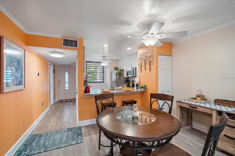 a view of a dining room with furniture window and outside view