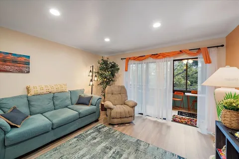 a bed room with furniture and a chandelier
