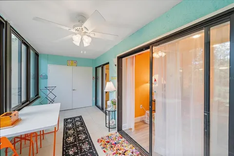 a spacious bedroom with a bed and ceiling fan